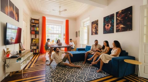 Communal lounge/ TV room, People, TV and multimedia, Living room, Seating area, Evening entertainment, group of guests