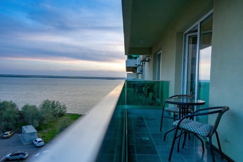 View (from property/room), Balcony/Terrace, Balcony/Terrace, Seating area, Lake view, Sunset