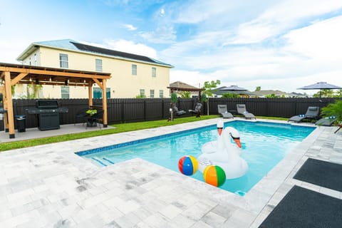 Pool view, Swimming pool, group of guests, sunbed