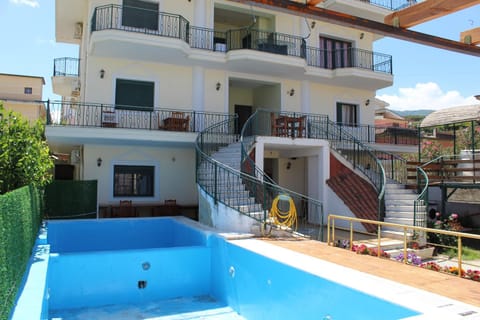 Property building, Patio, Balcony/Terrace, Pool view, Swimming pool