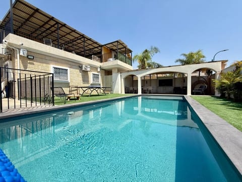Property building, Patio, Day, Pool view, Swimming pool
