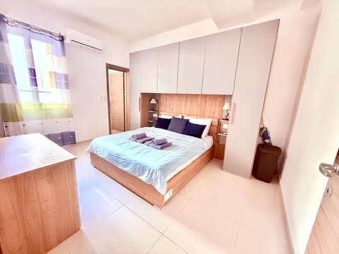 Bed, Photo of the whole room, Bedroom, hair dryier, towels, wardrobe, air conditioner