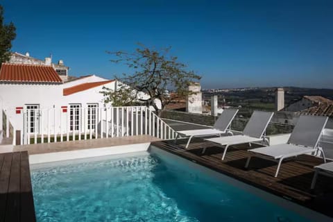 Property building, Patio, Natural landscape, View (from property/room), Balcony/Terrace, Pool view, Swimming pool, sunbed
