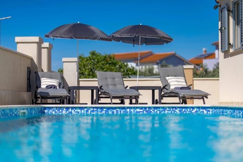 Patio, Day, Pool view, Swimming pool, sunbed