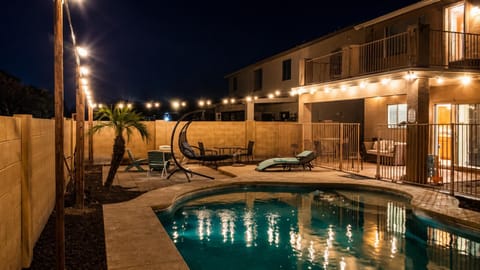 Patio, Night, Seating area, Swimming pool, sunbed