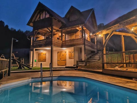 Property building, Patio, Night, Pool view, Swimming pool