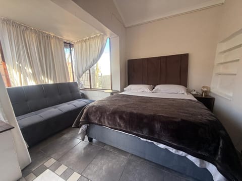 Bed, Seating area, Bedroom