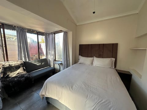 Bed, Living room, Seating area, Bedroom