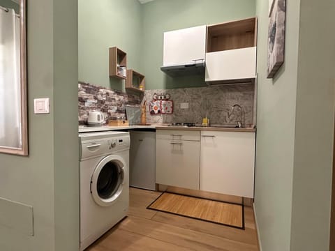 Kitchen or kitchenette, stove, washing machine