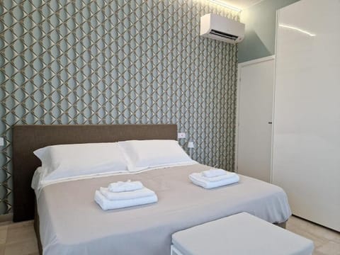 Bed, Bedroom, towels, wardrobe, air conditioner