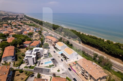 Property building, Nearby landmark, Day, Neighbourhood, Natural landscape, Bird's eye view, Beach, City view, Pool view, Sea view, Street view, Swimming pool, Location