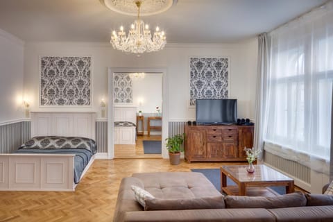 Bed, Living room, Seating area, Bedroom