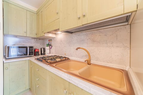 Kitchen or kitchenette, stove