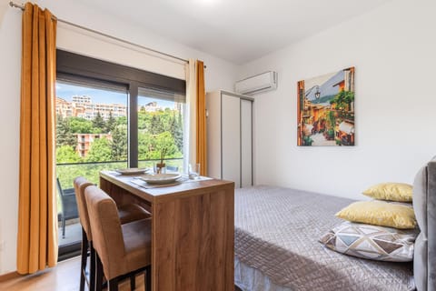 Bed, Dining area, wardrobe, air conditioner