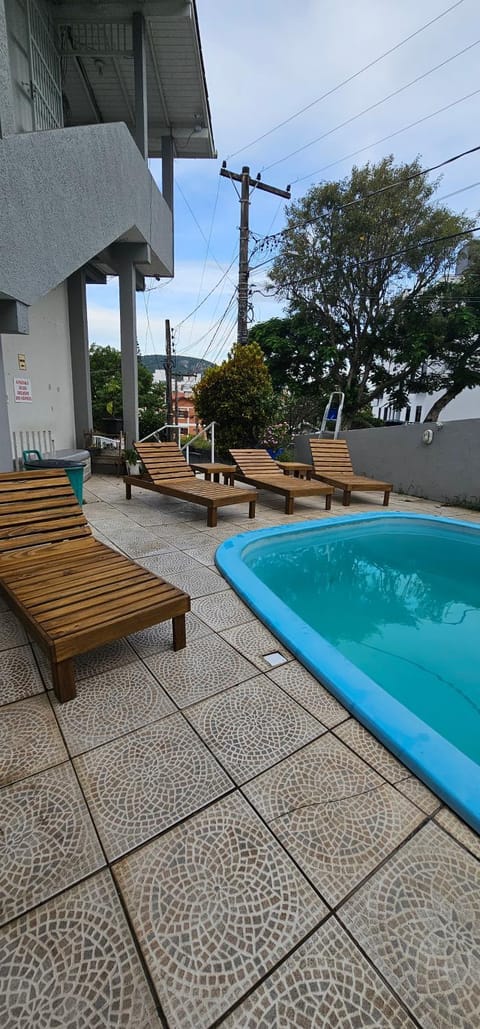 Property building, Day, Pool view, Swimming pool, sunbed