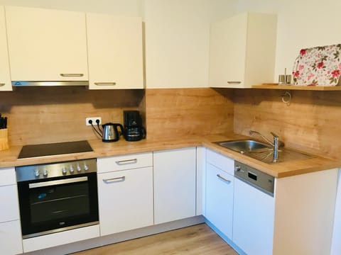 Kitchen or kitchenette, dishwasher, stove, toaster