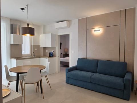 Bed, Kitchen or kitchenette, Living room, Seating area, Dining area, stove, stove, air conditioner, air conditioner