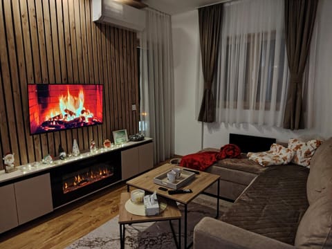TV and multimedia, Living room, Seating area, fireplace, air conditioner