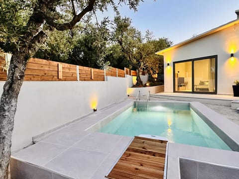 Property building, Patio, Day, Natural landscape, Pool view, Swimming pool
