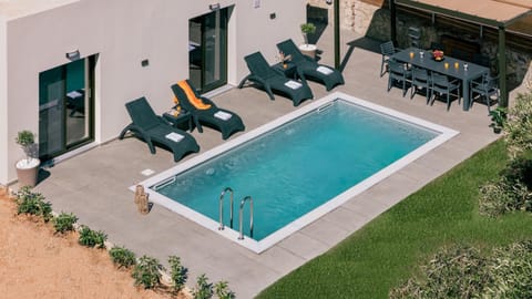 Property building, Patio, Day, Seating area, Pool view, Swimming pool, sunbed