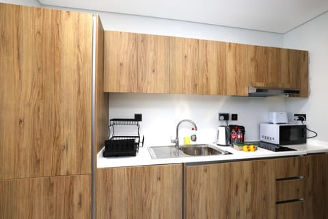 Kitchen or kitchenette, microwave, stove, toaster