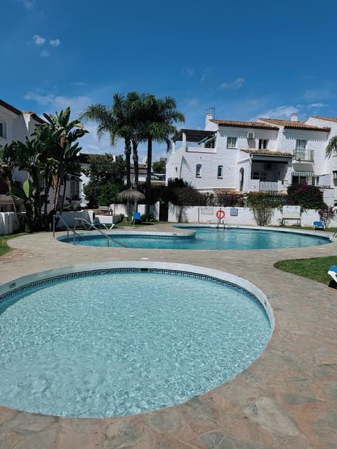 Property building, Pool view, Swimming pool, sunbed