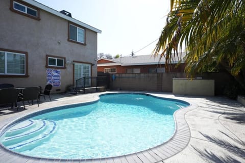 Property building, Patio, Day, Seating area, Swimming pool, Swimming pool