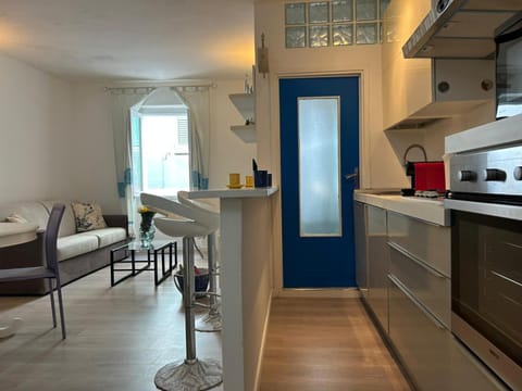 Kitchen or kitchenette, dishwasher, oven, stove