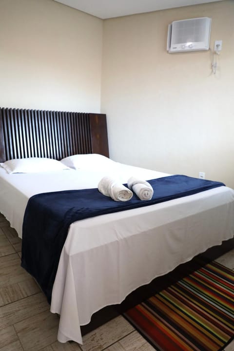 Bed, Photo of the whole room, Bedroom, towels, air conditioner