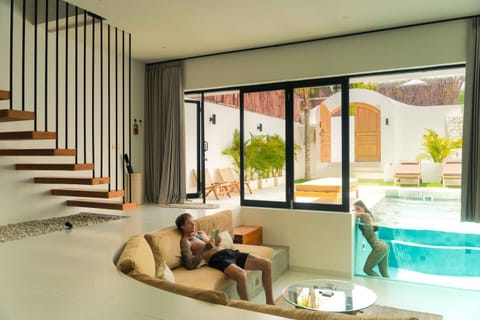 Living room, Seating area, Pool view