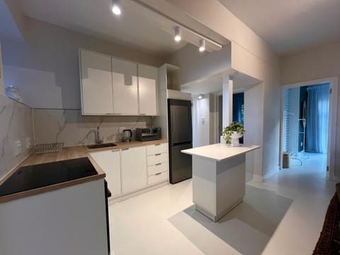 Kitchen or kitchenette, dishwasher, oven, stove