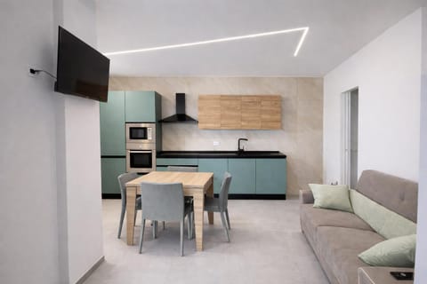 TV and multimedia, Kitchen or kitchenette, Living room, Seating area, Dining area, oven, stove