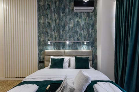 Bed, Photo of the whole room, Bedroom, towels, air conditioner