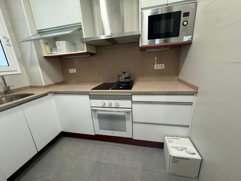 Kitchen or kitchenette, oven, stove