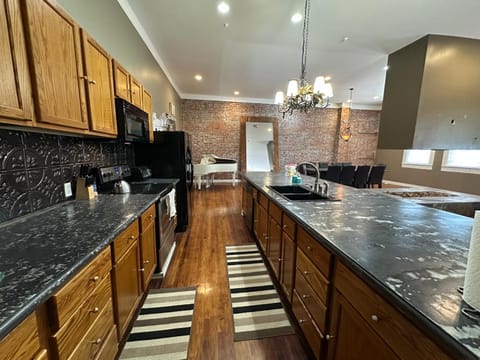 Kitchen or kitchenette, dishwasher, oven, stove