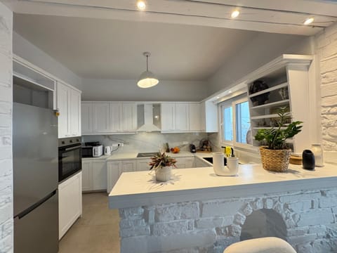 Kitchen or kitchenette, dishwasher, oven, stove