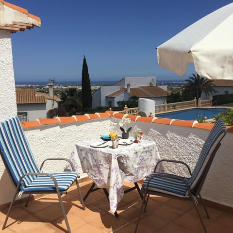 Natural landscape, View (from property/room), Balcony/Terrace, Seating area, Dining area, Pool view, Sea view, sunbed