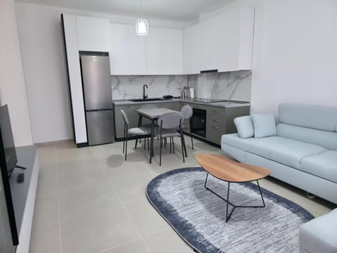 Kitchen or kitchenette, Living room, Seating area, Dining area