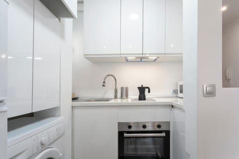 Kitchen or kitchenette, microwave, oven, washing machine, kitchen