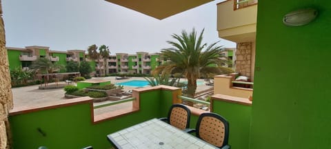 Property building, Patio, Day, Garden, View (from property/room), Balcony/Terrace, Pool view, Swimming pool, sunbed