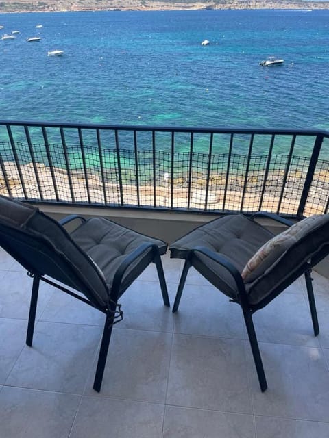 View (from property/room), Balcony/Terrace, Seating area, Beach, Sea view