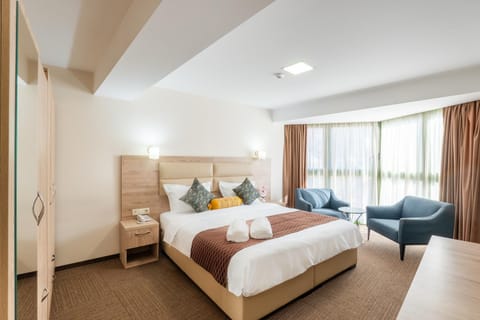 Bed, Living room, Seating area, Bedroom