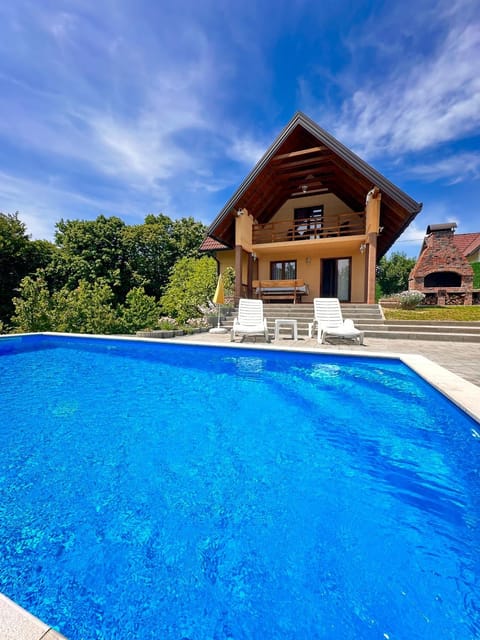 Property building, Pool view, Swimming pool, sunbed