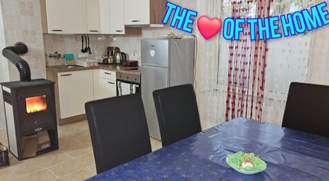 Kitchen or kitchenette, Dining area, fireplace, oven, stove, toaster, kitchen
