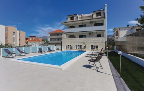 Property building, Patio, Day, Balcony/Terrace, Pool view, Swimming pool, Swimming pool, sunbed