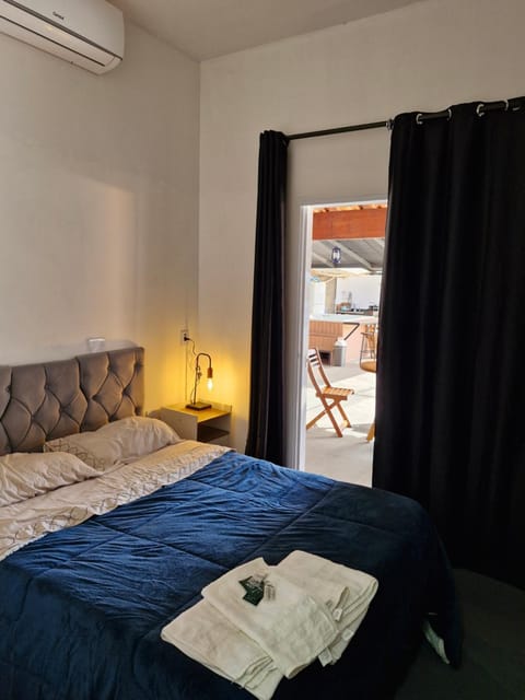 Bed, Photo of the whole room, Bedroom, towels, air conditioner