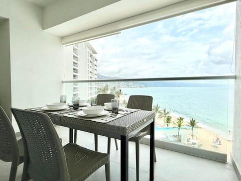 Property building, View (from property/room), Balcony/Terrace, Seating area, Dining area, Beach, Sea view, Swimming pool