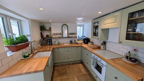 Kitchen or kitchenette, dishwasher, oven, stove