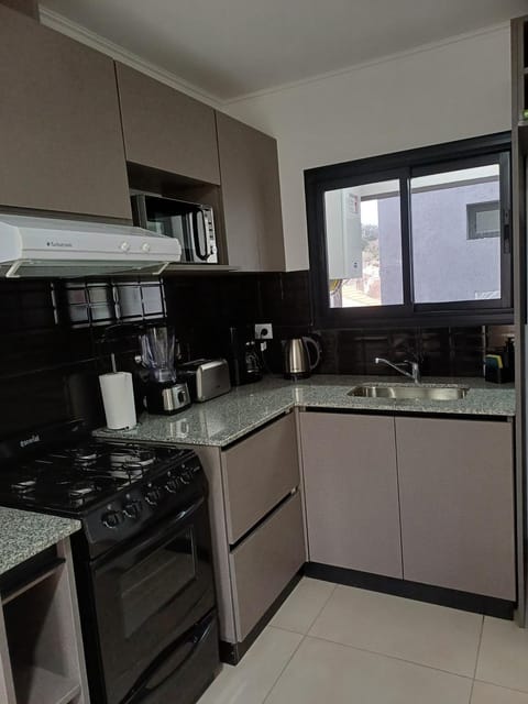 Kitchen or kitchenette, oven, stove