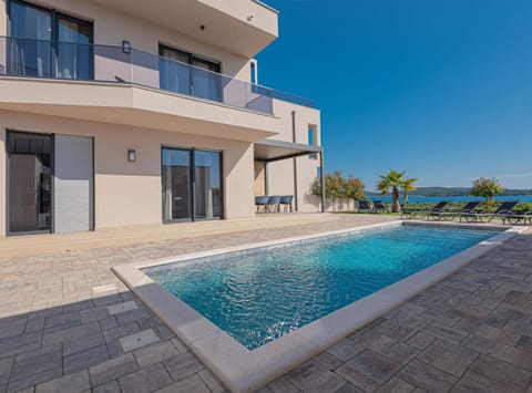 Property building, Day, Natural landscape, Pool view, Swimming pool, sunbed